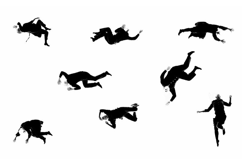 A black and white abstract image with eight human full human figures, spread evenly in three rows across a bright white field. The bodies are filtered as though they are a photo negative, their postures varied from flat on the back arms and legs extended, to curled on their side. Elbows and knees are bent creating unique shapes. Image by Ben Stechschulte.